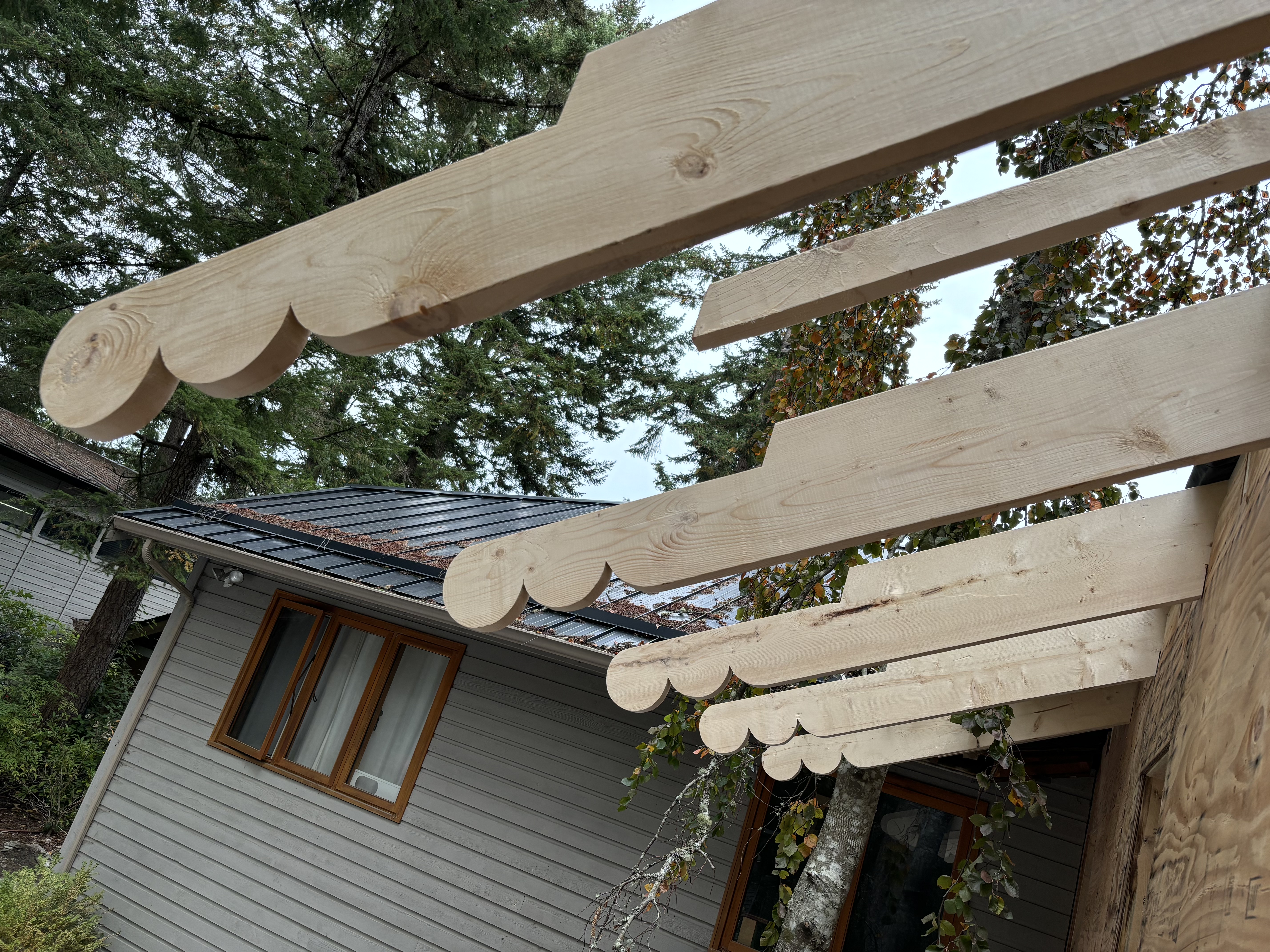 Custom shaped rafter tails during construction of the residential addition