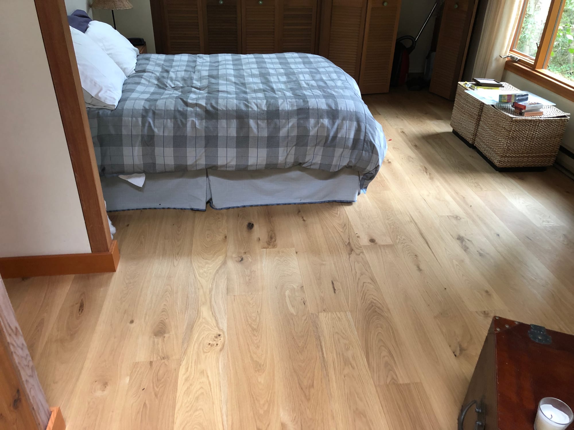 Guest suite — finished bedroom with wood flooring