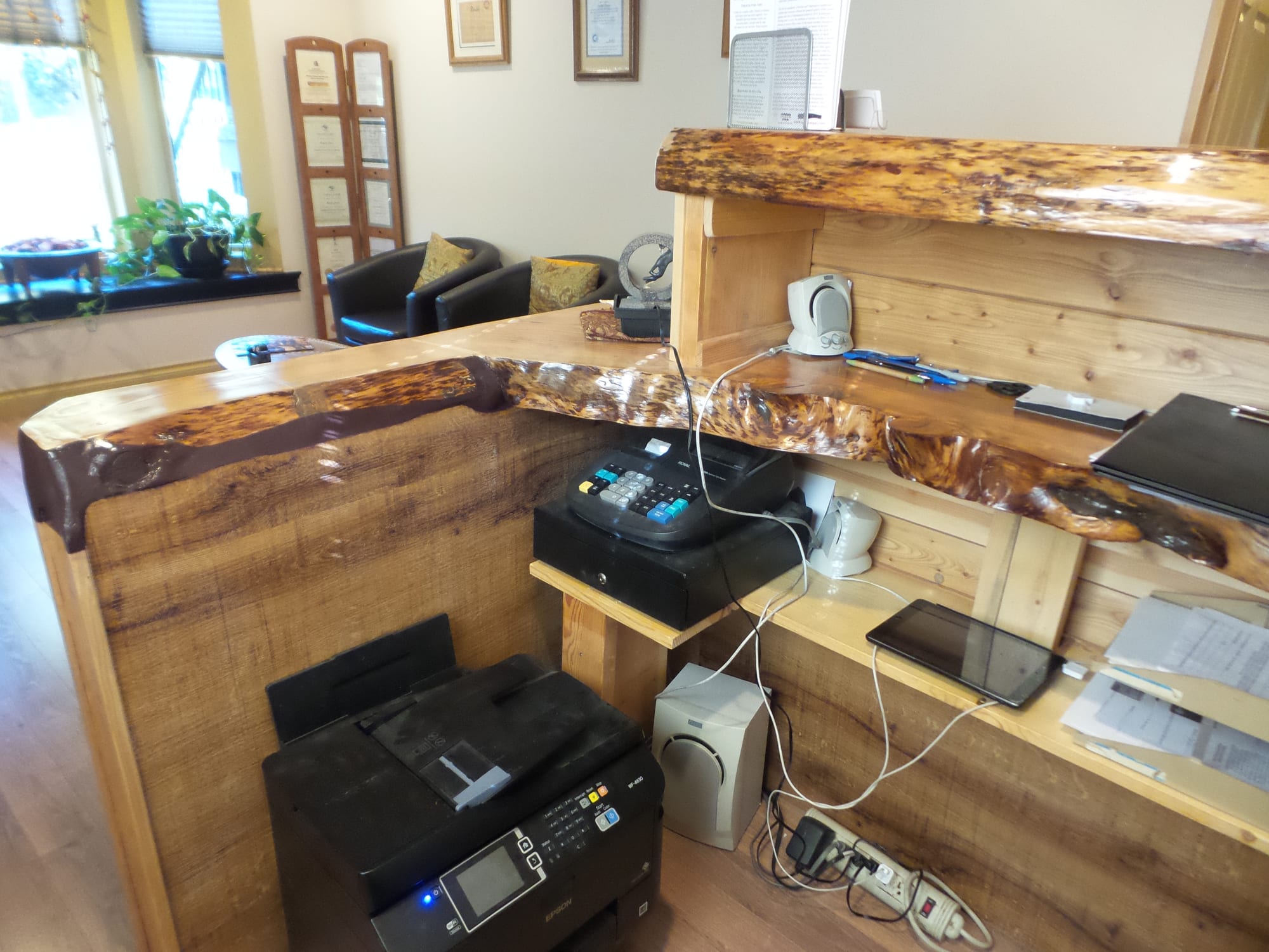 Custom cedar reception desk — wellness clinic commercial renovation