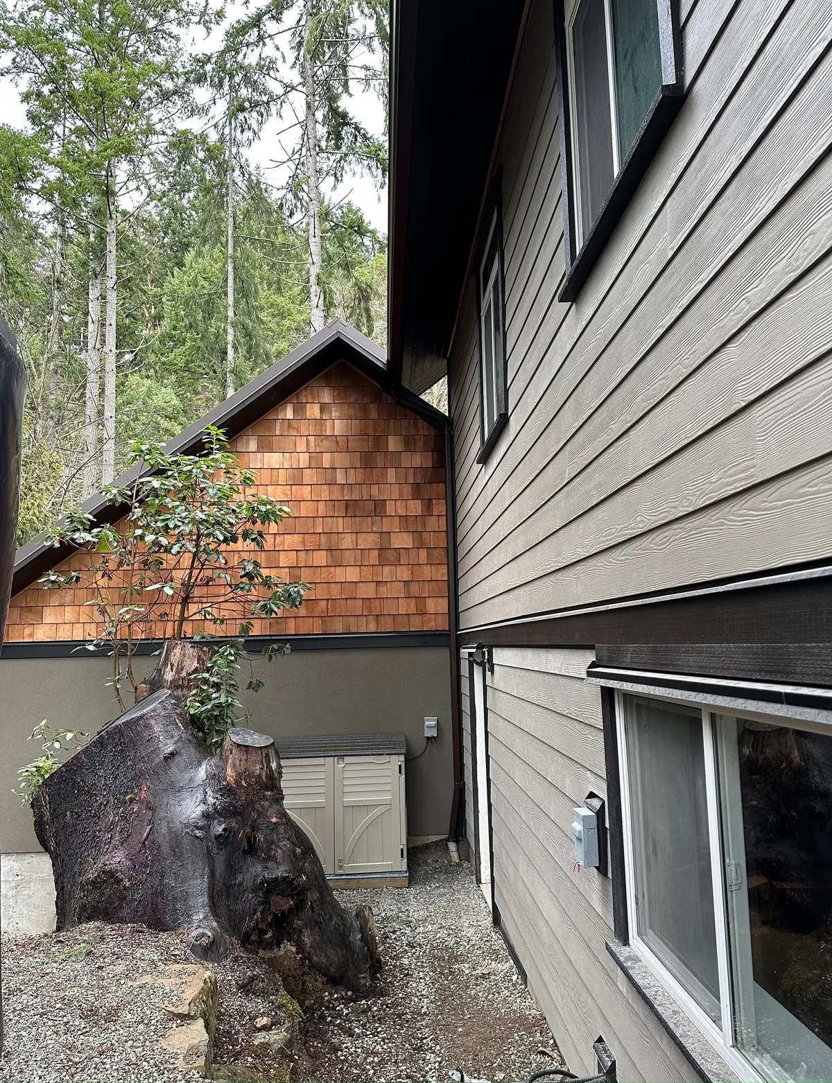 Addition — cedar-shake gable integrated beside an existing home