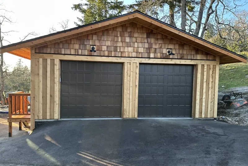 Custom cedar garage — completed two-bay exterior