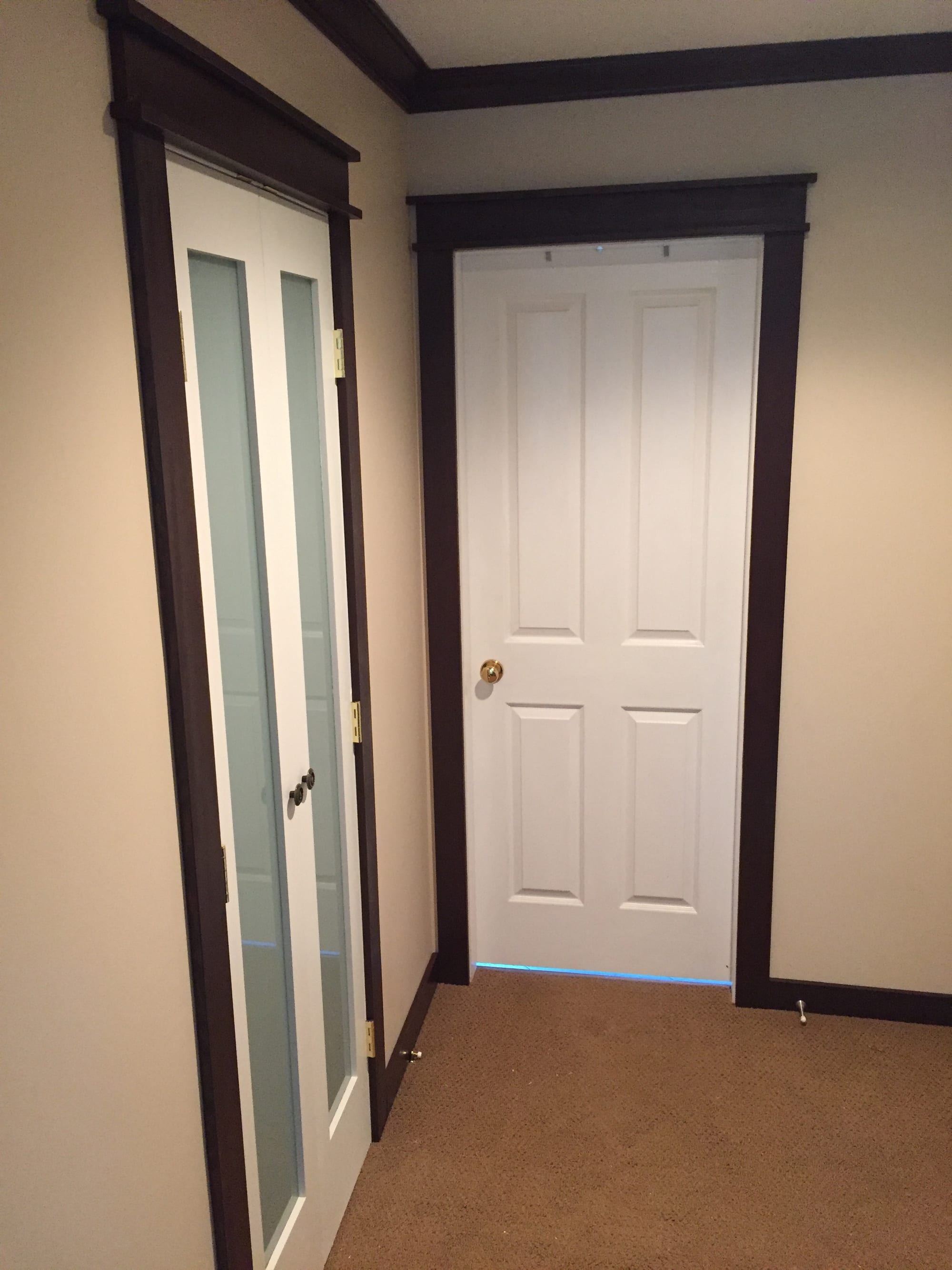Master bedroom door set with dark trim