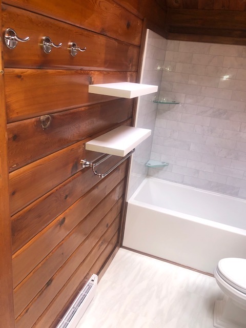 Bathroom tile and wood-clad wall detail