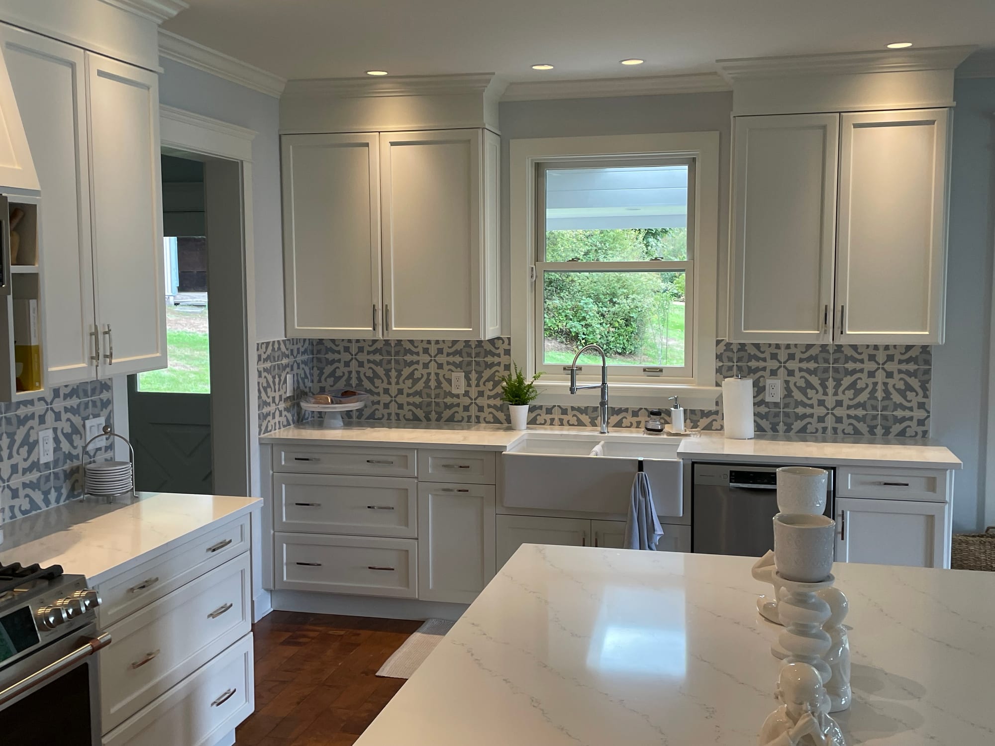 Substantially renovated kitchen — heritage home interior with new cabinetry, island and Moroccan tile backsplash