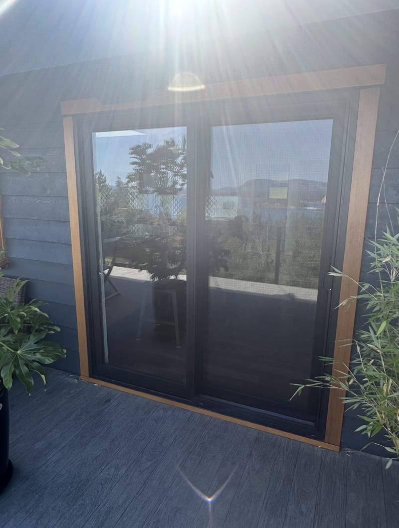 Ocean view estate — cedar-trimmed sliding doors with ocean view